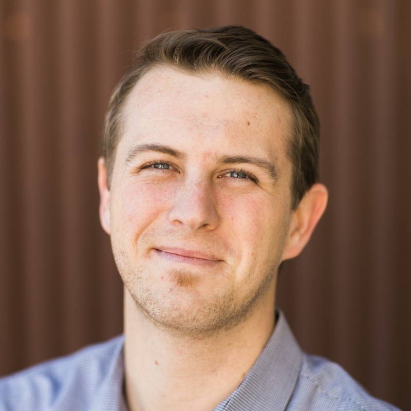 Dr._Jonathan_Noel seen with a short hair, hairstyle and in a grey color shirt